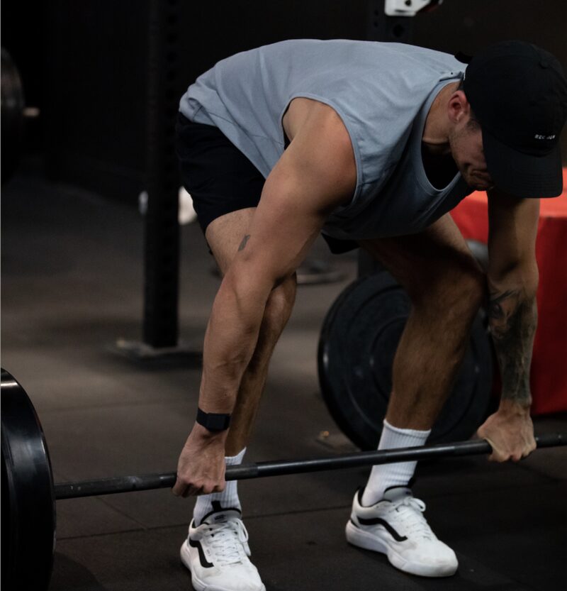 A REVL member at the bottom of a heavy deadlift