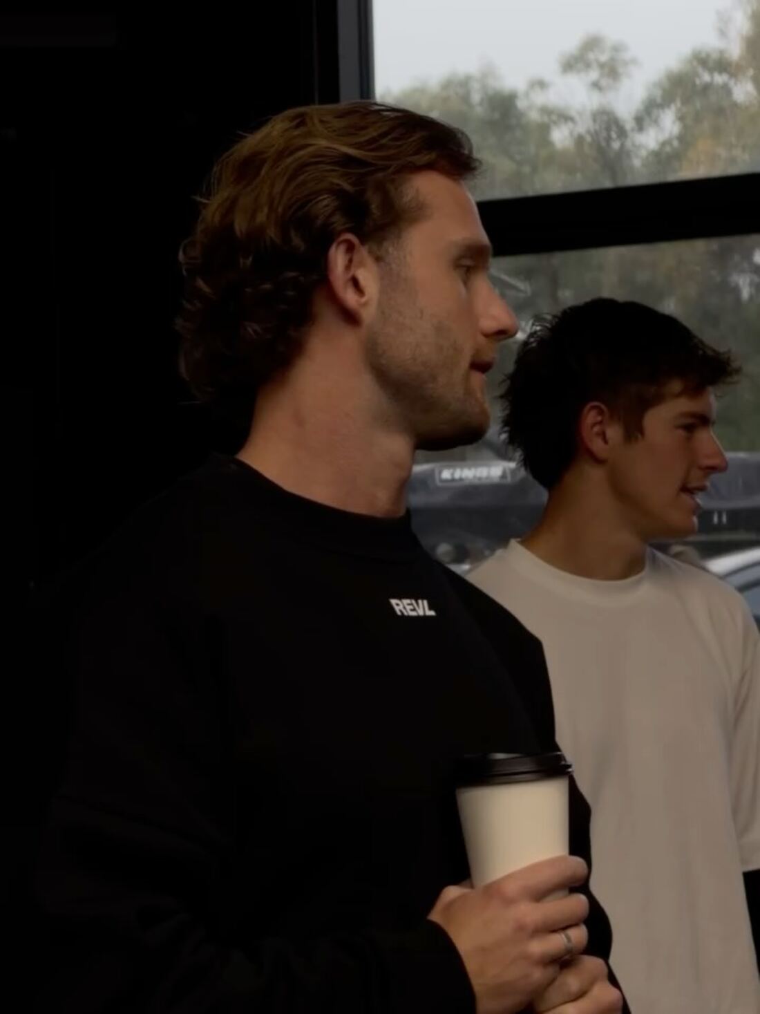 Two REVL members talking after a session